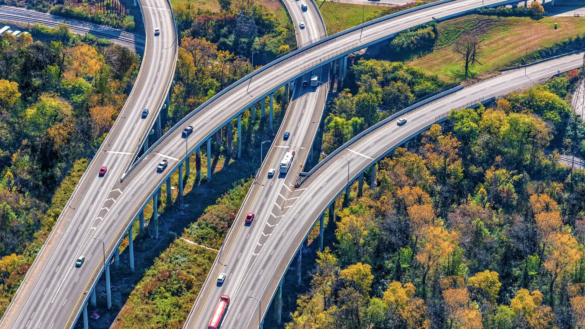 Composite image of separate east and westbound elevated interstate roadways splitting and merging into another north/south freeway shot aerially from about 1000 feet in altitude. This shot taken just outside of downtown Nashville, Tennessee.